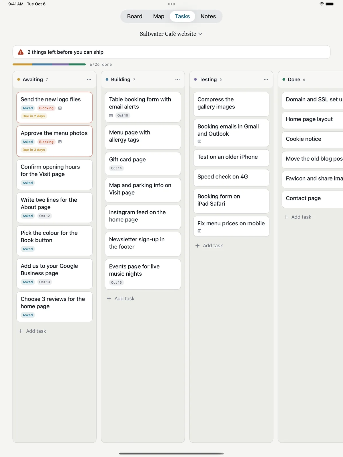 Tackpad on iPad, Tasks screen for a café website: tasks in Awaiting, Building, Testing and Done, with client questions, blockers and due dates.